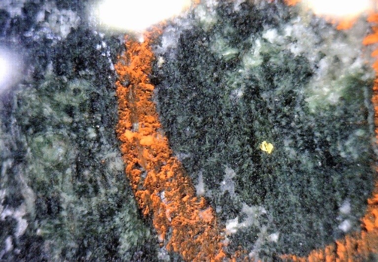 Scadding Deposit in the Sudbury Gold District- Gold associated with Fe-rich chlorite with variable magnetite, pyrite, pyrrhotite and minor to accessory chalcopyrite with (iron-sulfide alteration).